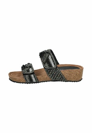 Sandales à glissière noires et argentées avec deux larges sangles à texture perlée. Le semelle en liège et la semelle en caoutchouc offrent un confort et une adhérence supplémentaires.