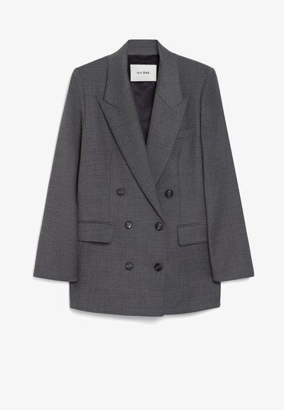 Hallitusheline hall bleiser, mis on valmistatud tekstureeritud kangast, millel on suured sakilised kraed, kaks eesmist taskut ja kuus musta nööpi.