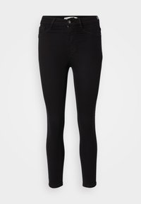 Svarta jeans i slim fit med medelhög midja, dragkedja, fem fickor och en slät yta. Ingen synlig branding eller mönster.