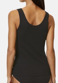 Black ribbed tank top with a scoop neckline and wide straps, featuring a fitted design and subtle stitching detail at the hem.