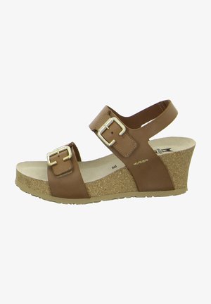 Sandali con zeppa in pelle marrone con due cinturini regolabili, dotati di fibbie in metallo, e una piattaforma in sughero testurizzato. Soletta morbida per il massimo comfort.