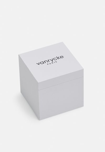 Bijeli pravokutni kutija s mat završnom obradom, s logotipom "vanrycke PARIS" u crnoj boji na poklopcu. Glatka tekstura, minimalistički dizajn.