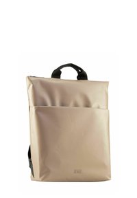 Sac à dos pliable en matériau imperméable doux et beige. Dispose d'une poche avant et de poignées noires. Design simple et moderne.