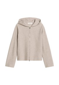Beige rits hoodie gemaakt van zachte stof. Heeft een brede capuchon, lange mouwen en een cropped ontwerp. De rits heeft een zilveren trekker.