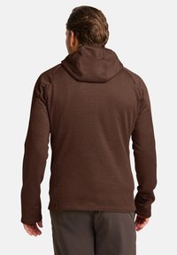 Bruine hooded sweatshirt met een textuurstof, raglanmouwen en een gestroomlijnd ontwerp. Kenmerken zijn onder andere een trekkoordkap en verlengde manchetten.