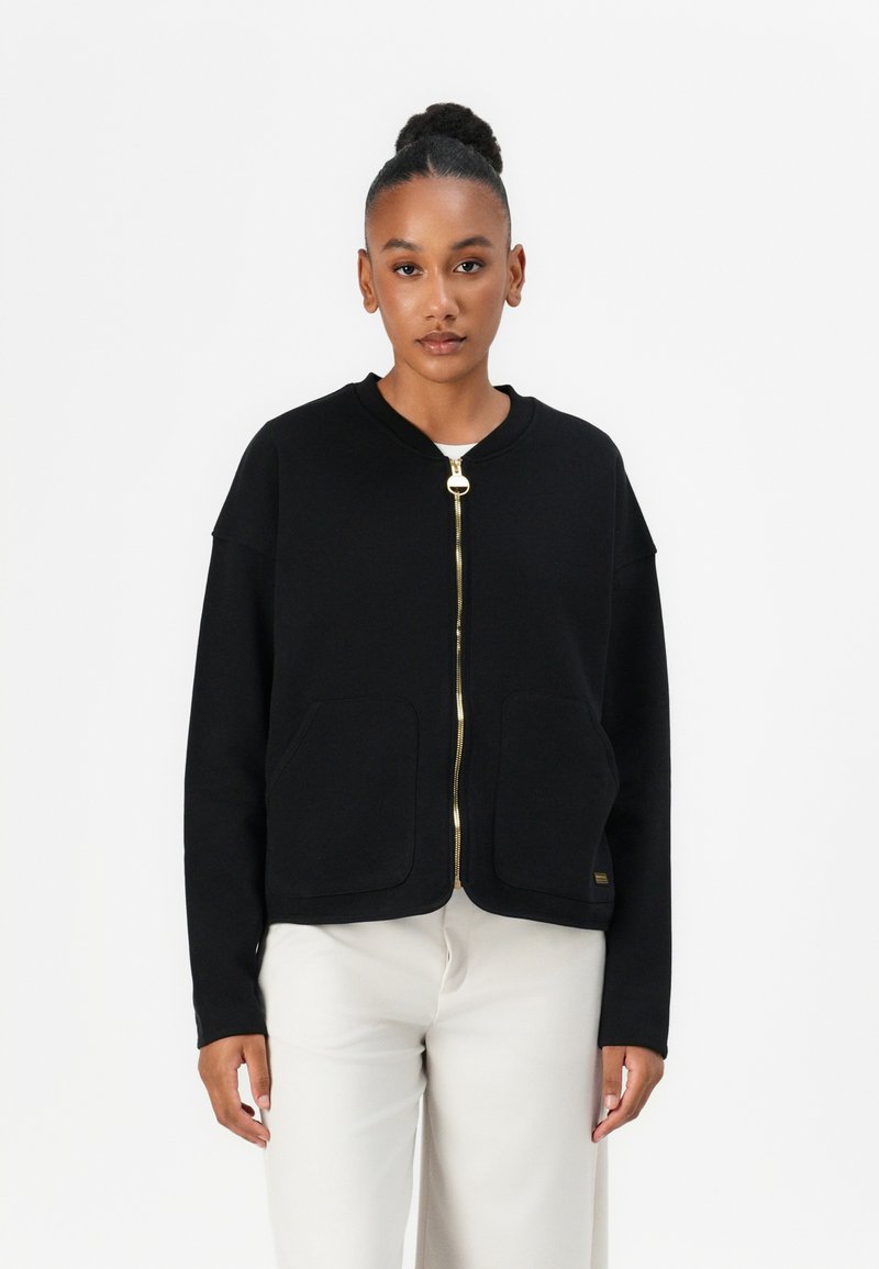 Schwarze Zip-up Sweatjacke aus weichem Stoff, mit rundem Ausschnitt, zwei Fronttaschen und goldenen Reißverschlussbeschlägen.