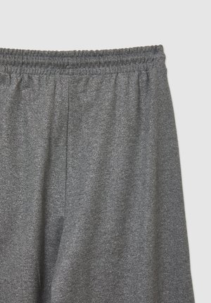 Pantaloni della tuta grigi con cintura elastica, texture morbida e vestibilità ampia. Design semplice senza motivi o accenti visibili.