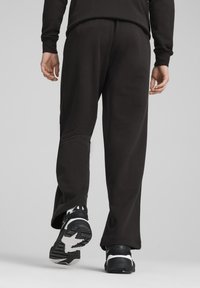 Puma RELAXED TRACK PANTS - Tepláky - black black