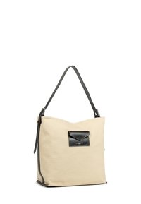Borsa a tracolla in canvas beige con una tasca accentata in pelle nera, tracolla grigia, texture morbida e forma morbida. Dettagli di cucitura nera visibili.