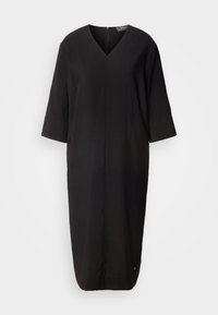 Robe noire en tissu léger, dotée d'un décolleté en V, de manches trois-quarts et d'une silhouette droite avec une fermeture éclair au dos.