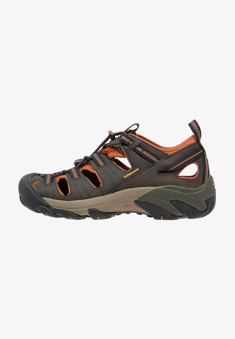 Brown waterproof sandal with orange accents, open toe design, multiple straps, textured rubber sole, and cutout details for breathability.