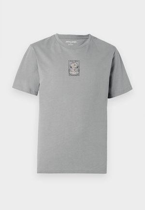 Grå bomullst-skjorte med rund hals. Har et sentralt grafisk trykkdesign innenfor en rektangulær ramme. Korte ermer og vanlig passform.