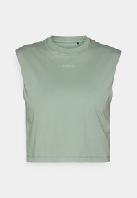 Light green sleeveless crop top made of soft fabric, featuring a round neckline and a small "BORG" logo printed on the front.