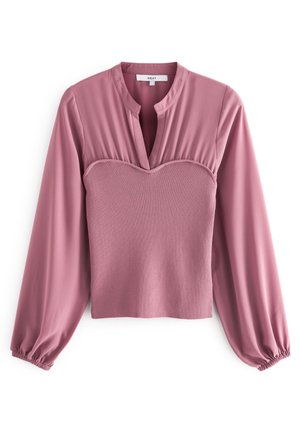 Langærmet bluse i mauve med opsmøgede manchetter, ribstrikket hjerteformet krop og V-formet udskæring på en ensartet hvid baggrund.