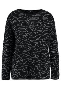 Schwarzer Pullover mit langen Ärmeln, der ein welliges silbernes Muster aufweist. Der Stoff wirkt strukturiert und weich. Rundhals-Ausschnitt, lockere Passform.