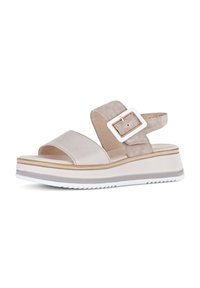 Světle béžové platformové sandály s dvěma pásky, jeden hladký a druhý z semiše. Obsahují obdélníkovou bílou sponu a vroubkovou bílou podrážku.