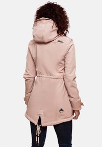 Light pink waterproof jacket with a cinched waist, hood, and drawstring. Features stitched detailing and a logo accent on the back.