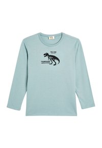 Valkoinen pitkähihainen t-paita pehmeästä kankaasta, jossa on musta dinosauruksen grafiikka ja teksti "WILD ZONE TYRANNOSAURUS VAALEA JA VOIMAKAS."