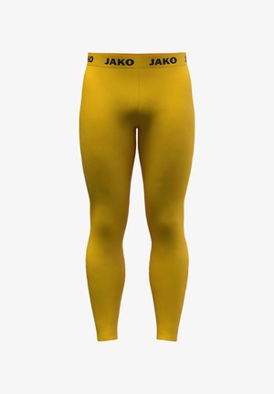 Yellow athletic leggings made of stretchy material with a black "JAKO" waistband, featuring a smooth texture and fitted design.