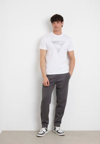 Guess MID WAIST JOGGING - Jogginghose - dunkelgrau