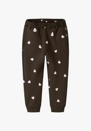 Brune joggebukser laget av mykt stoff, med et rosa hjerte mønster. De har elastisk midjebånd og sidelommer, med ribbede mansjetter.