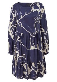 Robe bleu marine à manches longues avec une coupe ample, ornée d'un motif abstrait de visage d'animal blanc et d'une jupe à volants.