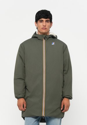 Olive green parka with hood, featuring a zip closure with a multi-colored stripe, and logo on the chest. Soft lining visible at the collar.
