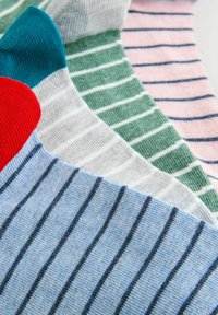 Cotton socks in various colors: red, teal, gray, green, pink, and blue. Each features thin, contrasting stripes and ribbed cuffs.