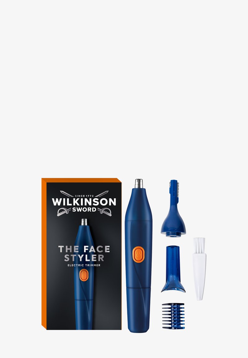 Elektrisk blå og oransje Wilkinson Sword ansiktstrimmer med fem avtakbare pleiehoder og en liten rengjøringsbørste, ved siden av sin svarte og oransje eske.