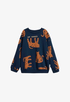 Marineblauw sweatshirt met oranje kattenillustraties en polkadots. Heeft een ronde halslijn en geribbelde manchetten. Zachte stoftextuur.