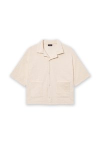 Korte mouw, crèmekleurig shirt met een textuur golvenpatroon, geplooide kraag en twee voorzakken. Knopen sluiting aan de voorkant.