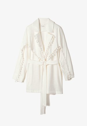 White lightweight jacket with a collar, featuring textured pom-pom trim along the edges and a matching belt for closure. Long sleeves.