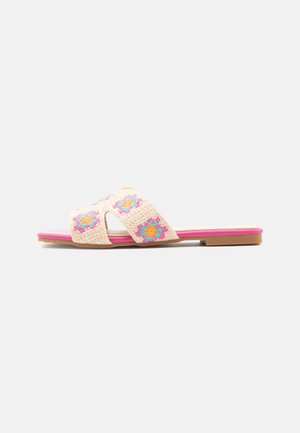 Flat slide sandal with pink sole and beige crocheted straps featuring colorful flower patterns.