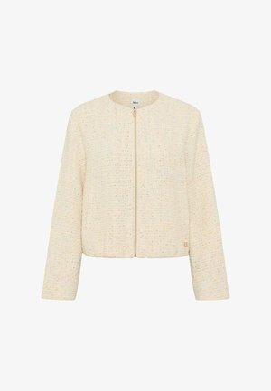 Kremfarvet tekstureret damesjakke med lange ærmer, rund halsudskæring og lynlåslukning foran.