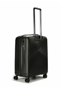 Valigia rigida nera con design scanalato, manico retrattile, manico laterale, lucchetto TSA e quattro ruote multidirezionali.