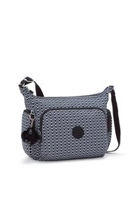 Black and white patterned shoulder bag with adjustable strap, textured fabric, front zipper pocket, and decorative pom-pom charm.
