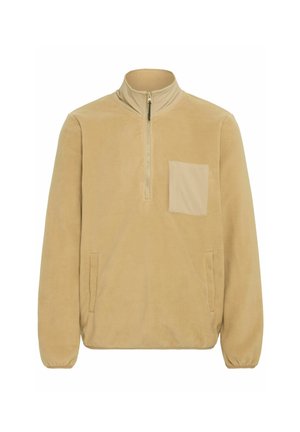 Sudadera de forro polar beige con media cremallera en la parte delantera, cuello alto y un bolsillo cuadrado en el pecho. Incluye bolsillos laterales y puños elásticos. Textura suave.