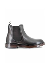 Stivale Chelsea in pelle nera con pannelli laterali elasticizzati, punta rotonda e suola intermedia in legno. Presenta una linguetta sul retro per facilitarne l'indossamento.