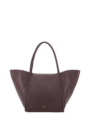 Large dark brown leather tote bag with two long handles and a slightly textured surface, featuring small gold logo text near the base.