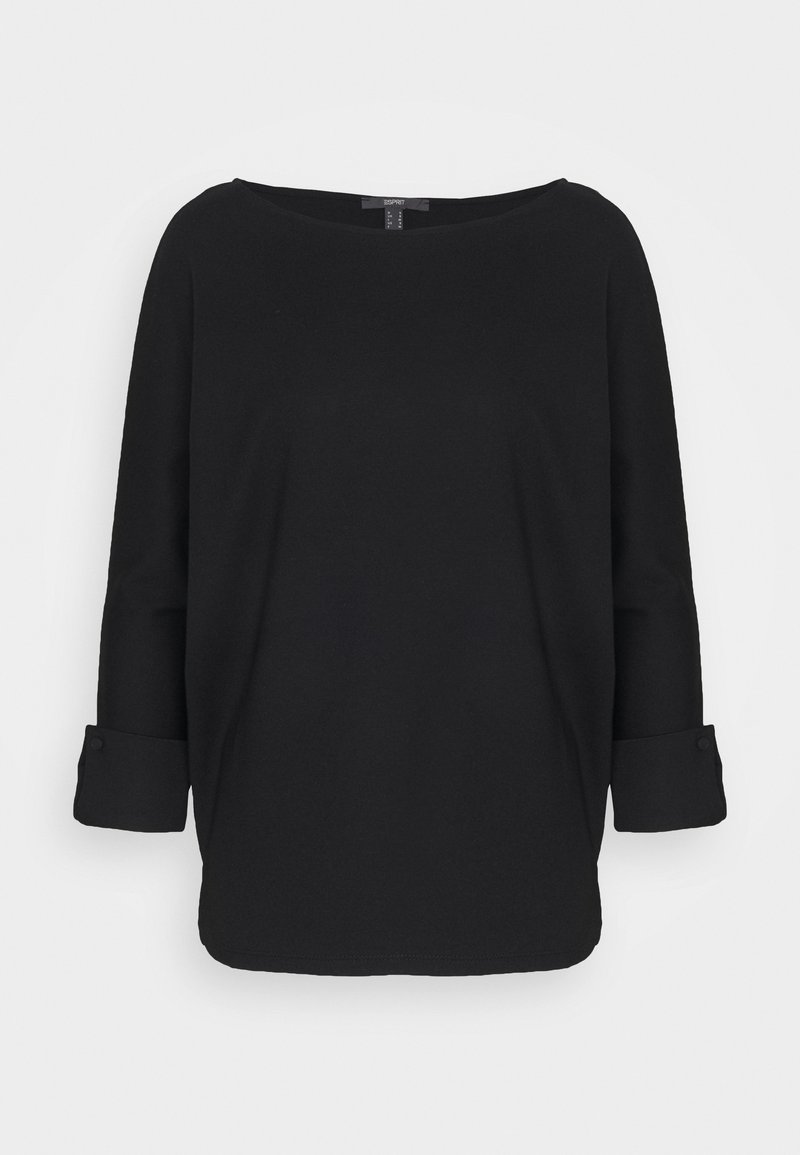 Musta pitkähihaisen paita, jossa leveä kaula-aukko, käännetyt hihansuut ja pehmeä materiaali. Paidassa on pyöristetty helma ja väljä istuvuus mukavuutta varten.