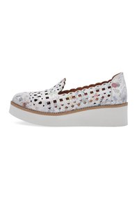 White slip-on shoes with cut-out design, floral pattern, and scalloped edges. Features a light platform sole with a textured finish.