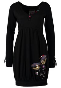 Robe noire à manches longues avec des boutons colorés sur le col, un papillon en sequins, et le texte "Pourquoi ?" en bas à droite.