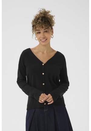 Black knitted cardigan with a v-neck, featuring gold buttons and scalloped hem details. Long sleeves and a soft texture.