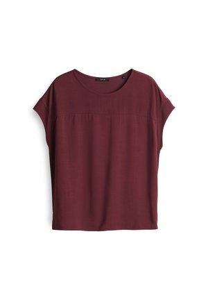 Burgundy short-sleeve top with a round neckline, featuring a relaxed fit, soft fabric, and subtle horizontal seam detail across the chest.