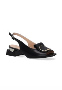 Black leather slingback shoe with a textured surface, round open toe, a wide strap with a gold accent, and a geometric block heel.