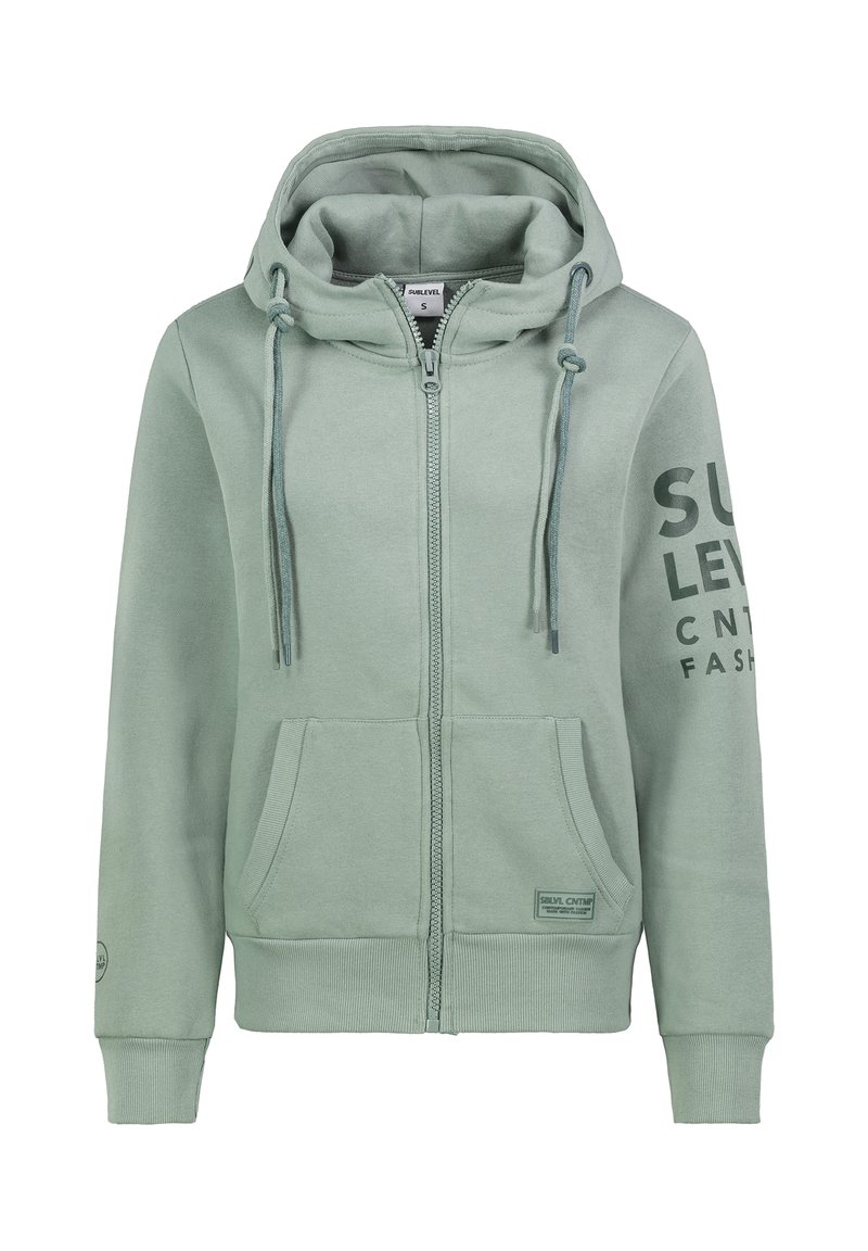 Hellgrüner Reißverschluss-Hoodie mit Kapuze und Kordelzug, Fronttaschen und gummiertem Druck am Ärmel. Weicher Stoff mit gerippten Bündchen.