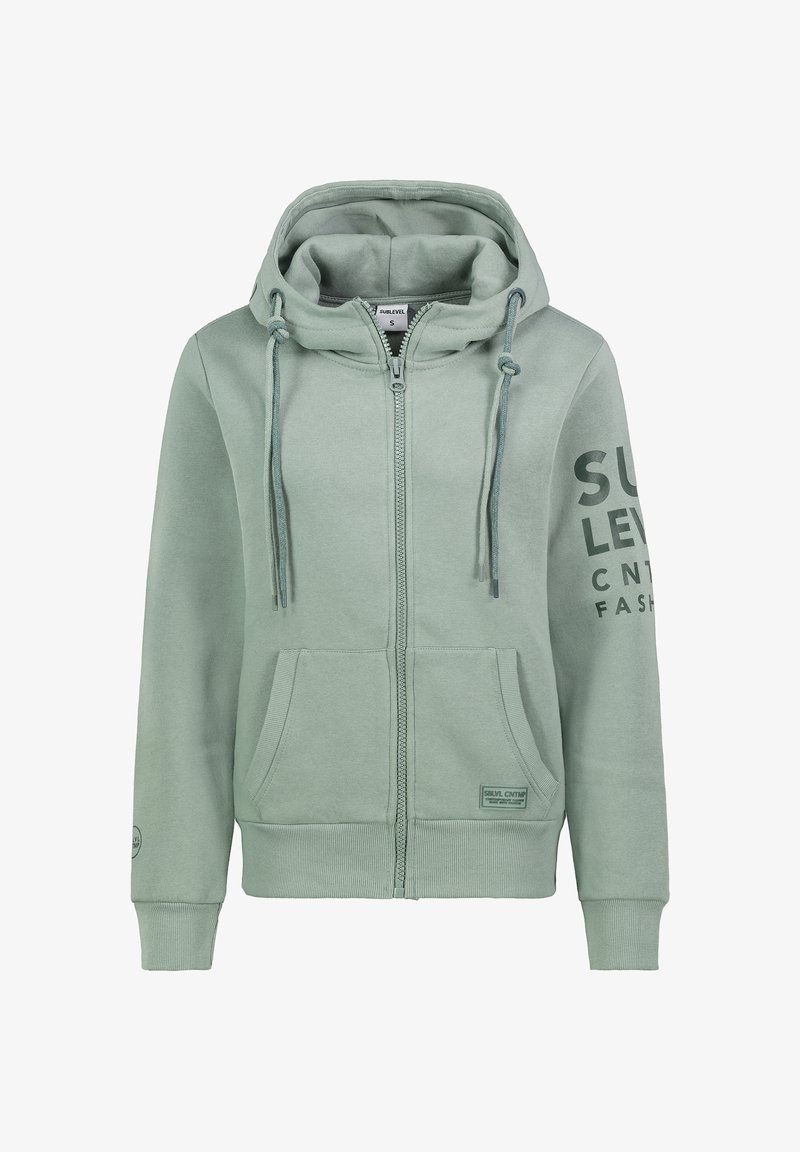 Hellgrüner Reißverschluss-Hoodie mit Kapuze und Kordelzug, Fronttaschen und gummiertem Druck am Ärmel. Weicher Stoff mit gerippten Bündchen.