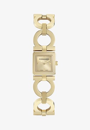 Goldene Ferragamo-Armbanduhr mit quadratischem Zifferblatt, minimalistischem Zifferblatt und charakteristischem Armband mit kreisförmigen und G-förmigen Gliedern.