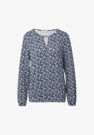 Garā piedurkne blūze ar melnu, zilu un baltu ģeometrisku rakstu un nelielu priekšējo atvērumu apļa formā.