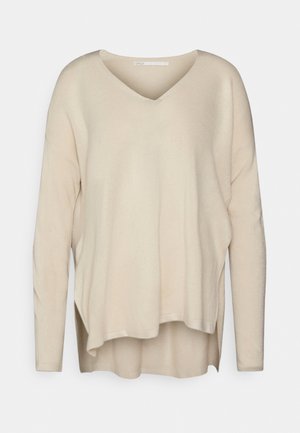 Stickad tröja - beige